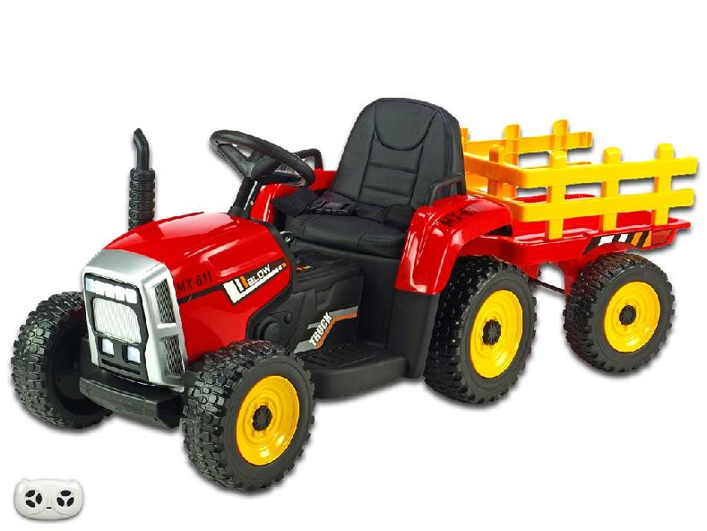 Elektrický rozkošný traktor s vlekom červený